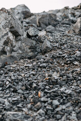 Mining process. Rocks for mining. Big gray limestone.