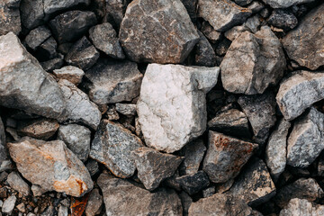 Mining process. Rocks for mining. Big gray limestone.
