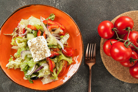 salad with vegetables and cheese with Caesar sauce