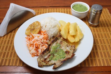 Grilled pork with avocado sauce