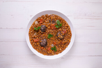 Traditional spanish tapas lentejas con chorizo y morcilla