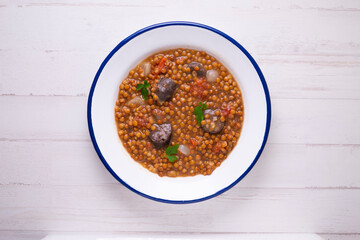 Traditional spanish tapas lentejas con chorizo y morcilla