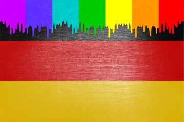 Paint (rainbow flag) is dripping over the national flag of Germany