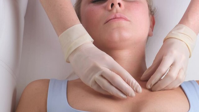 Skincare - woman cleavage massage at salon.
