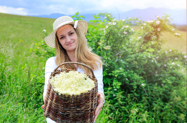 A woman holds a basket full of floral foundations just collected. Copy the text or description...