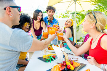 Multiracial friends having fun in backyard home party - Friendship concept with young people...