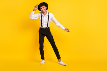 Fototapeta na wymiar Photo portrait full body view of african american guy dancing isolated on vivid yellow colored background