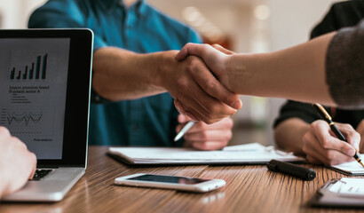 close up. young people greeting each other at the work table.