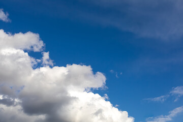 The background is from the blue sky and white clouds. The location of the clouds diagonally.