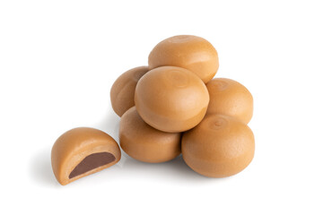 pile of caramel candies isolated on white background
