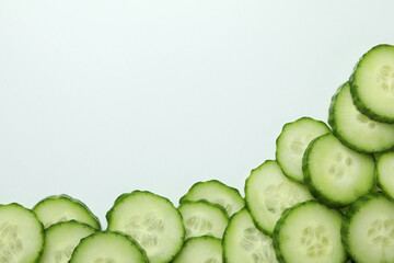 Fresh ripe cucumber slices on white background