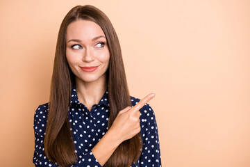 Photo of young woman happy positive smile indicate finger empty space ad promo select suggest...