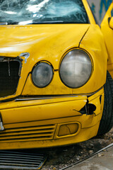 Close up of a Yellow car glass damage caused by accident.