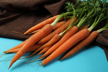 Kitchen towel with carrot on blue background