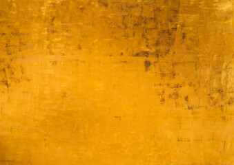 Vintage golden wall with matte paint texture with gilded effect, dark stains and scratches on...