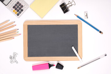 school set: black chalkboard and school supplies isolated on white background with copy space for your text