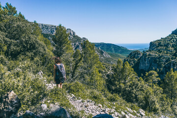 Fototapeta na wymiar woman hiking on a mountain path in catalonia