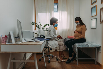 Young woman on pregnancy exam during Covid 19