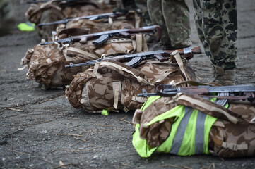 Special forces military training. Photograph detail with military equipment and assault rifle.
