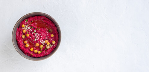 Beet hummus in a gray bowl. Healthy eating. Vegetarian food.