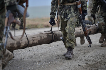 Special forces military training. Photograph detail with military equipment and assault rifle.
