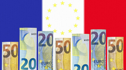 Euro banknotes rolled up in a tube on the background of the flag of France. The currency of the European Union.