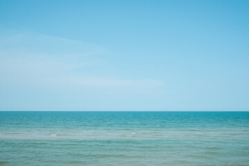 Seascape with sea horizon and almost clear deep blue sky on a sunny day