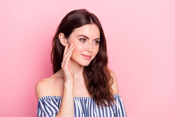 Photo of nice optimistic brunette lady look empty space wear blue dress isolated on pastel pink color background