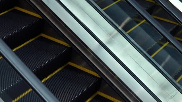Empty moving escalator in department store
