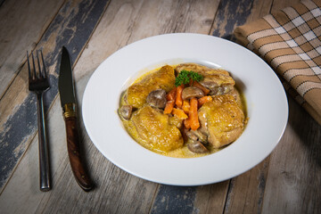 Recipe for chicken fricassee in white wine, with a carrot and mushroom planter, High quality photo