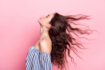 Photo of sweet pretty young lady wear off-shoulders clothes wind blowing closed eyes isolated pink...