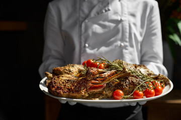 freshly cooked young lamb for Easter holiday, served by the waiter plate © izikmd