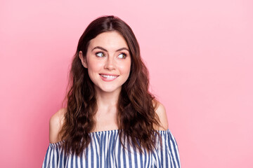 Fototapeta premium Photo of charming shiny young lady wear off-shoulders clothes biting lip looking empty space isolated pink color background