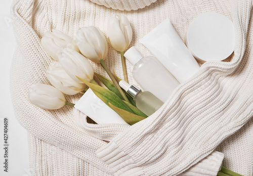 Flat lay flowers and cosmetics. Happy Mother's Day, top view stylish female and spring concept. Blog hero header background. Gift for women. Natural care cosmetics and spa