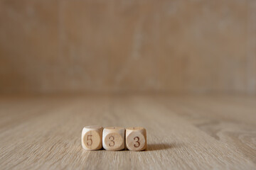 Wooden dice on wooden table