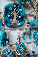 Turkey, Bodrum.Ceramic greek mill souvenirs on the shop window.