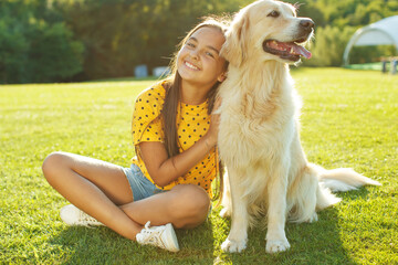 A child with a dog. A child plays with a dog in nature. High quality photo.