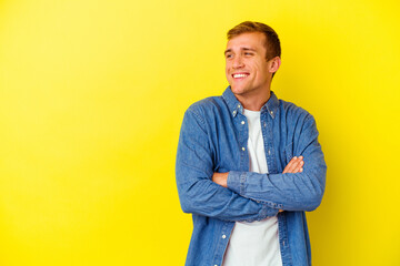 Fototapeta premium Young caucasian man isolated on yellow background