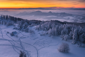 Winter morning in Gorce on the tower on the top of Luban. A beautiful, romantic atmosphere with a view of the Pieniny Mountains, the Beskids and the Tatra Mountains.

