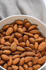 Almonds in bowl.Selective focus.Top view.Food backgound.