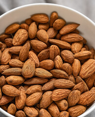 Almonds in bowl.Selective focus.Top view.Food backgound.