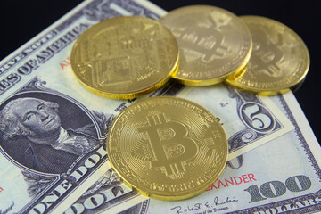 Dollar banknote and Golden coins with bitcoin symbol isolated on black background, symbol of new money