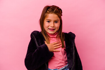 Little caucasian girl isolated on pink background