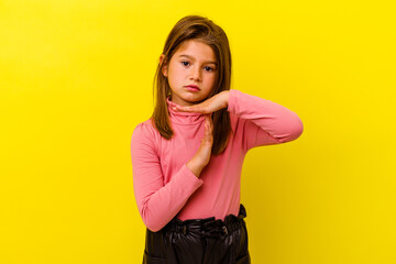 Little caucasian girl isolated on yellow background showing a timeout gesture.