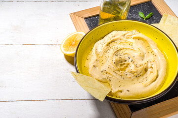 Mediterranean traditional food. Hummus with chickpeas, paprika, olive oil and oriental spices. Healthy diet snack of chickpeas and tahini pasta.