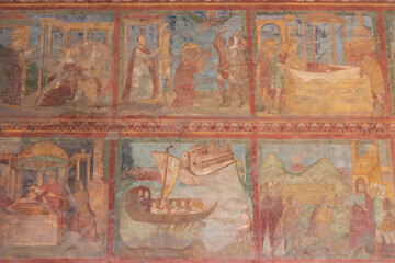 The original frescoes of St. Lawrence and St. Stephen at San Lorenzo outside the walls(RM) , Italy , depict scenes from the lives both being martyred,young deacons.