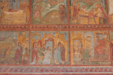 The original frescoes of St. Lawrence and St. Stephen at San Lorenzo outside the walls(RM) , Italy , depict scenes from the lives both being martyred,young deacons.
