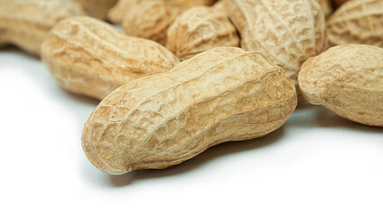 Dried peanuts, Monkey nuts, Groundnuts in shell, Isolated on white background close up