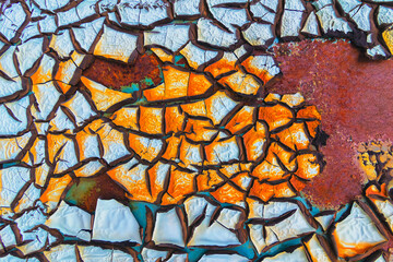 Abstract background of textured blue cracked wall.