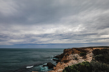 Beautiful ocean view over rocky cliffs on overcast day at Cape Nelson, Portland Victoria Australia